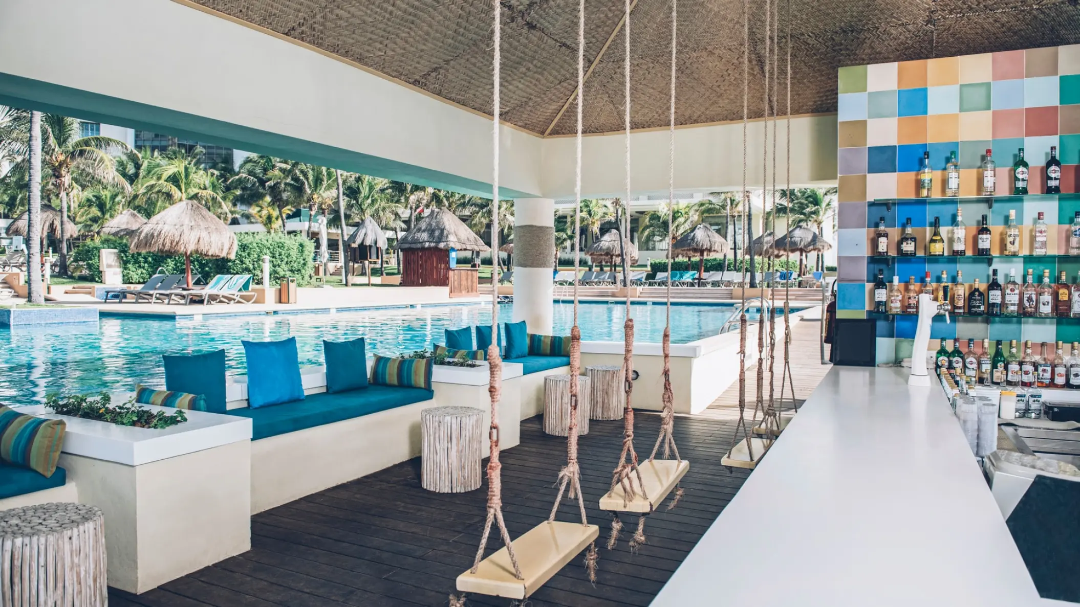 Iberostar Selection Cancun pool bar with rope swings and colorful tile decor, Cancun