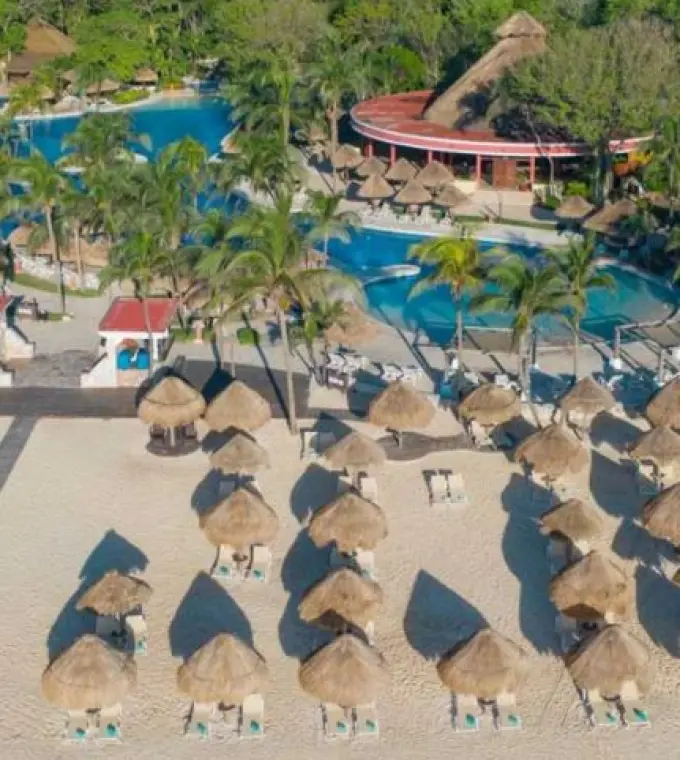 Aerial view of the beachfront pool and palapas at Iberostar Waves Tucan, Playa Del Carmen