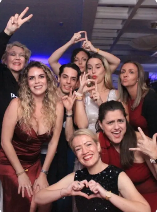 Paradise Weddings team members smiling and posing together at a group event