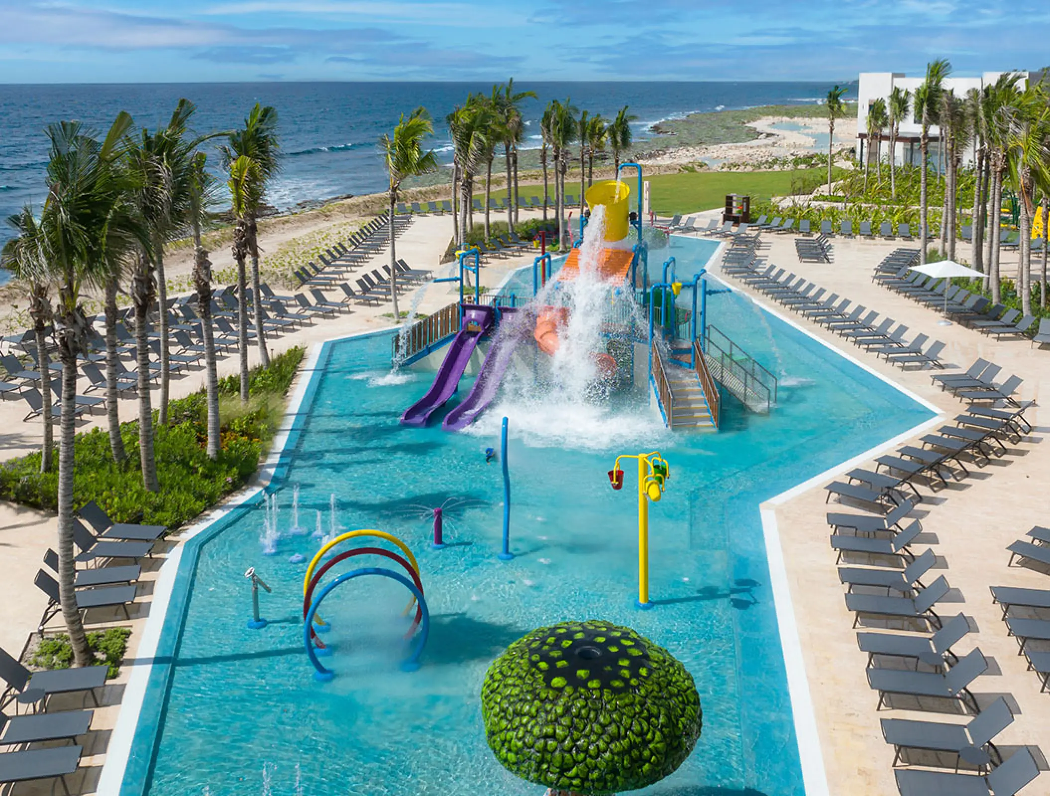 Aerial view of the family-friendly water park and splash pool at Hilton Tulum