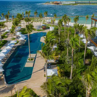 Aerial view of the pools and beachfront grounds at Hilton Tulum, Tulum