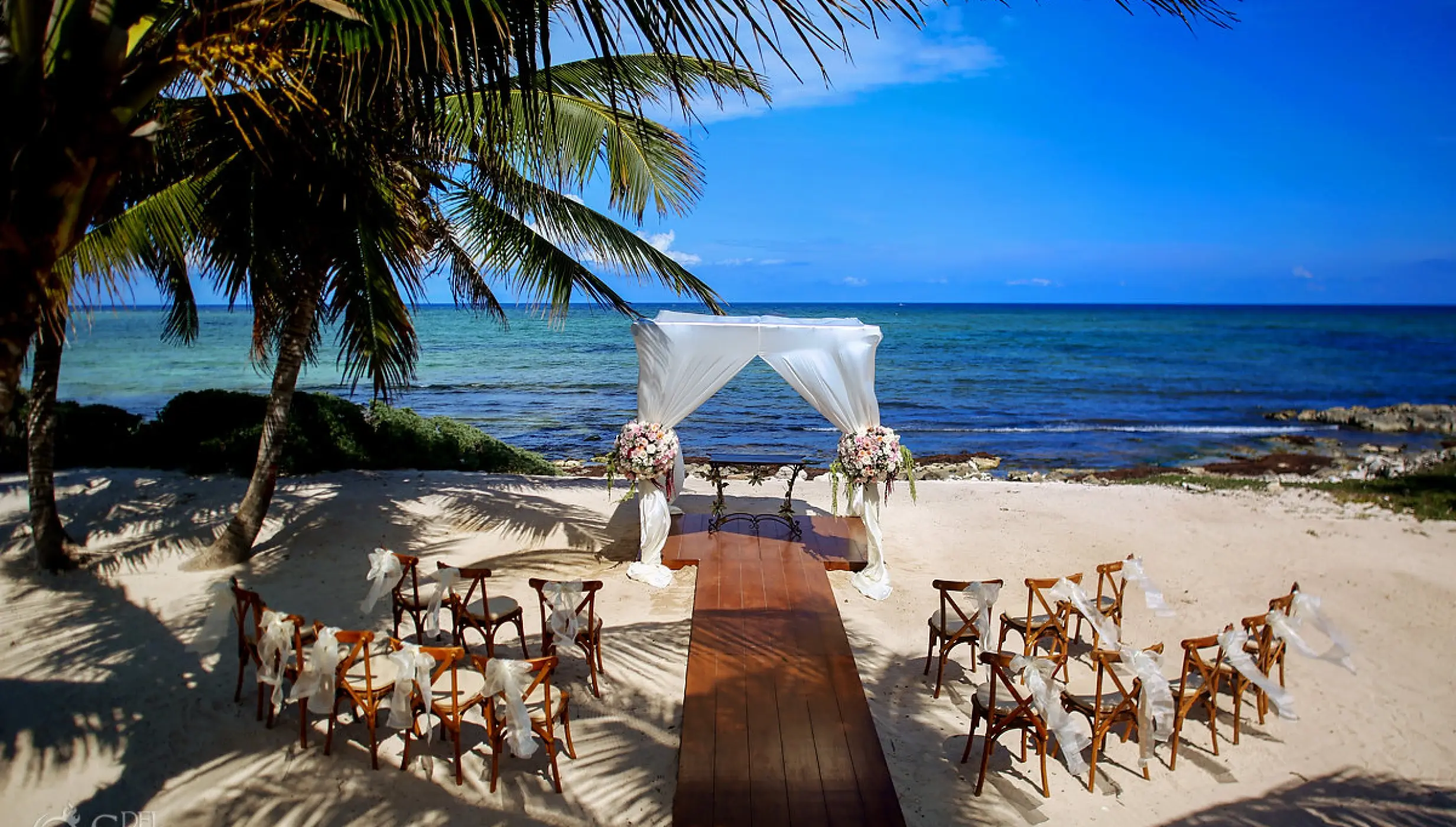 Ceremony decor in labna beach venue at akumal bay beach and wellness resort