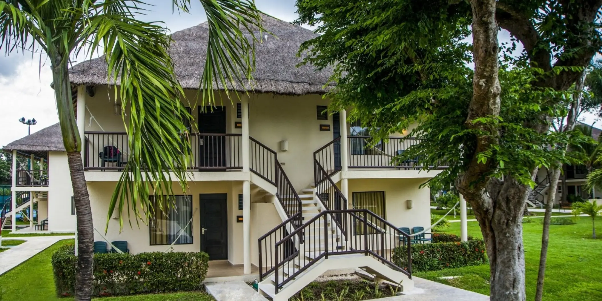 Caribbean-style bungalow suites with thatched roofs at Allegro Playacar, Playa Del Carmen