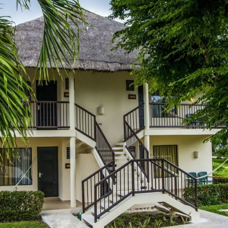 Caribbean-style bungalow suites with thatched roofs at Allegro Playacar, Playa Del Carmen