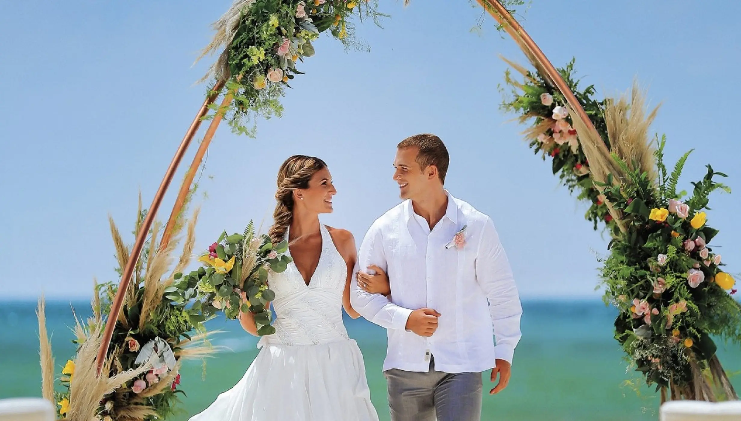 Couple at wedding ceremony in beach venue at allegro playacar resort