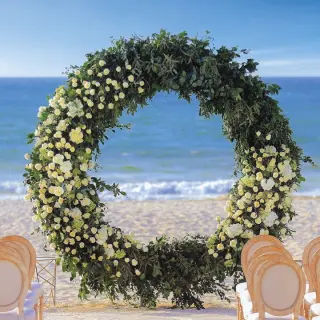 Floral circle arch for a beach wedding ceremony at Allegro Playacar, Playa Del Carmen