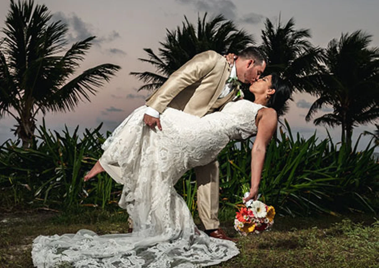 groom and bride deep kiss