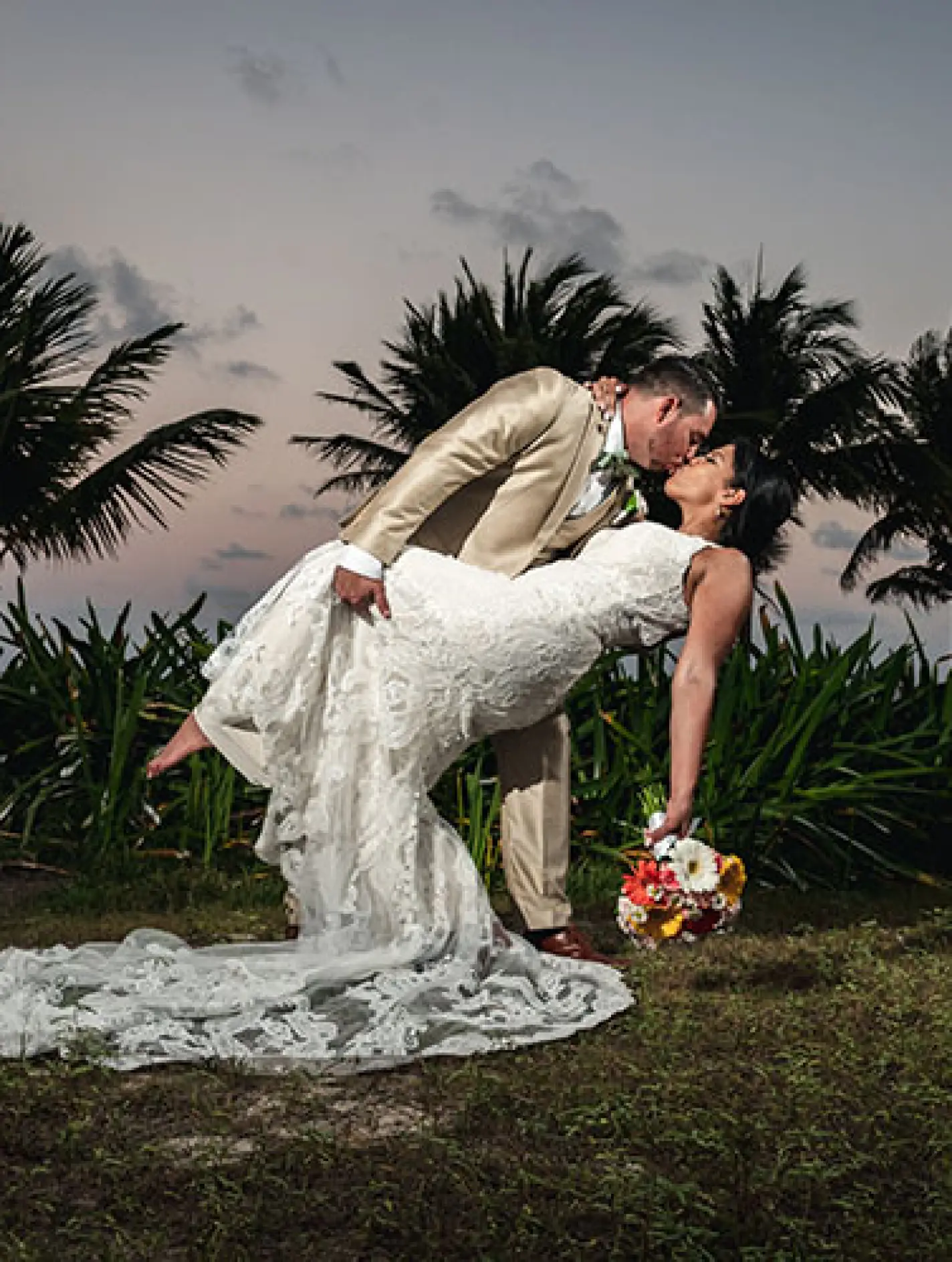 Allinson and John's sunset dip and kiss at their destination wedding in Mexico