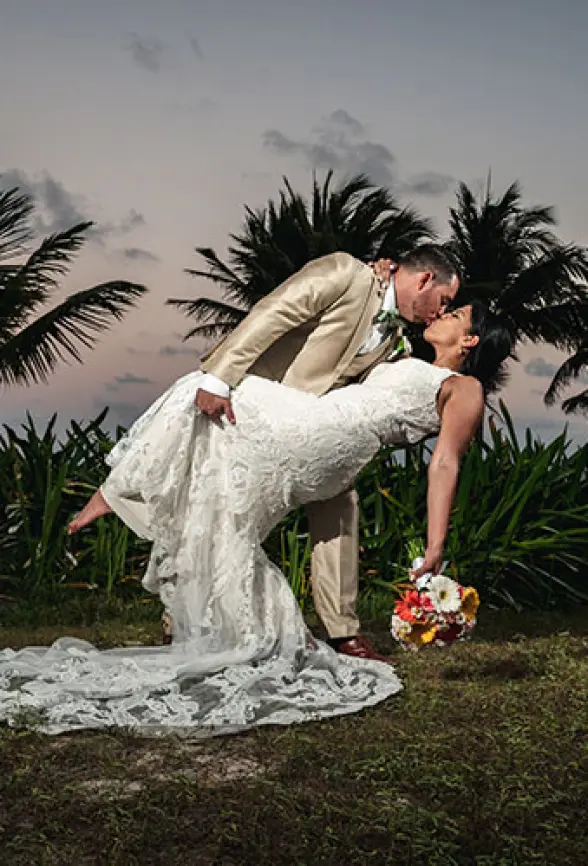 Allinson and John's sunset dip and kiss at their destination wedding in Mexico