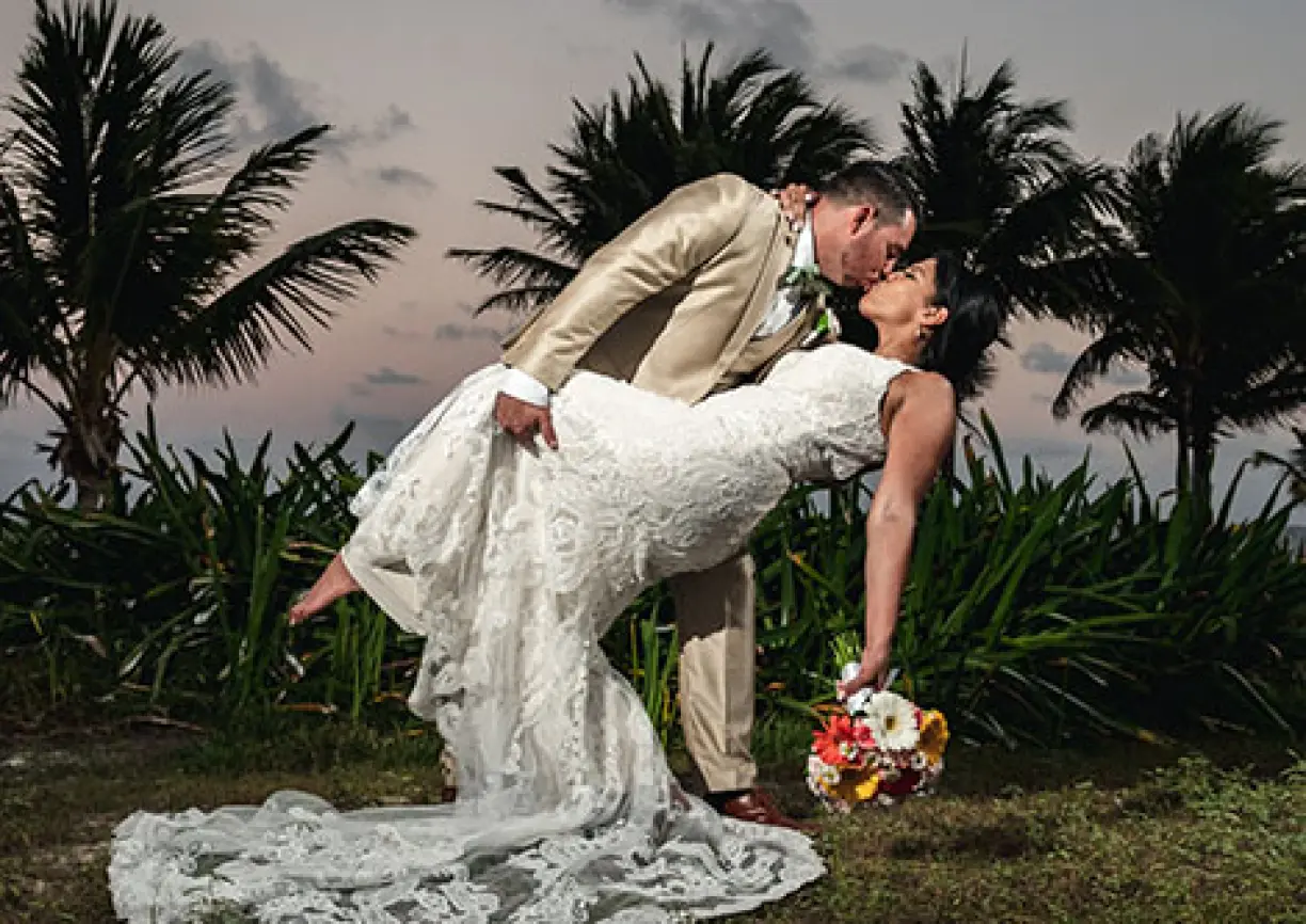 Allinson and John's sunset dip and kiss at their destination wedding in Mexico