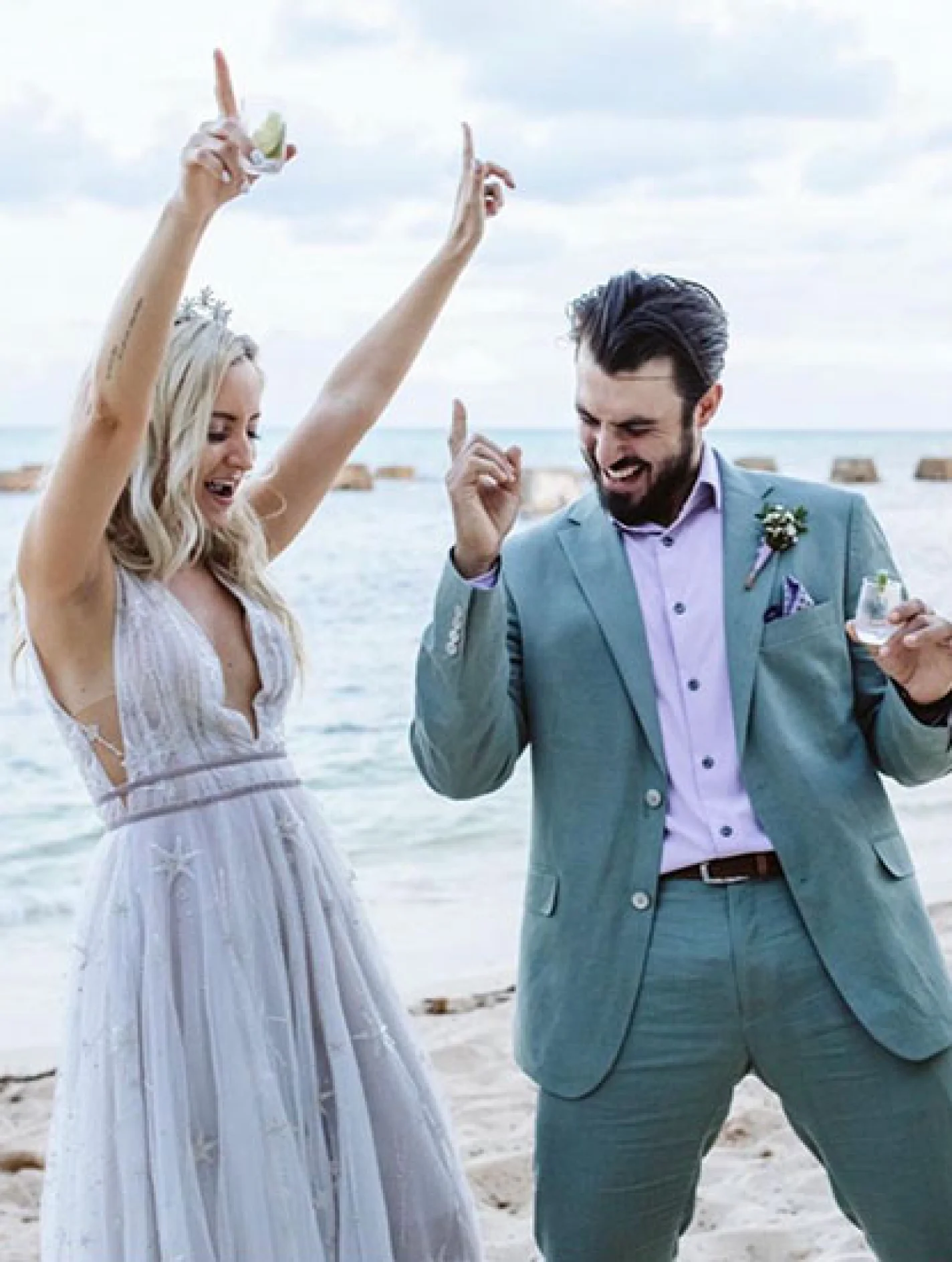 Newlyweds have fun on the beach