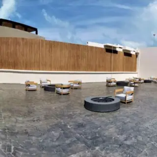 Atelier Playa Mujeres Los Abrazos terrace with fire pits and lounge seating, Cancun