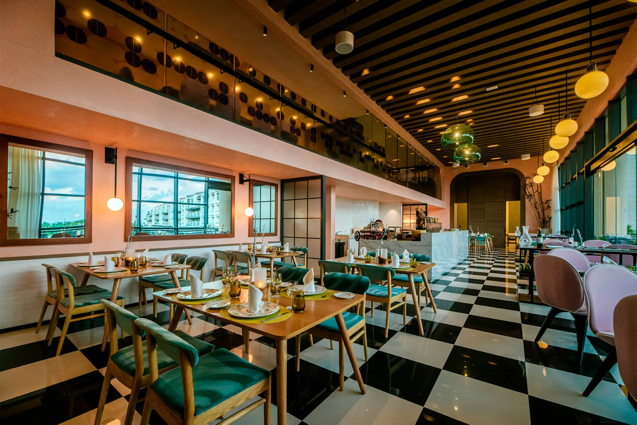 Cilento restaurant with checkered floors and contemporary decor at Atelier Playa Mujeres, Cancun