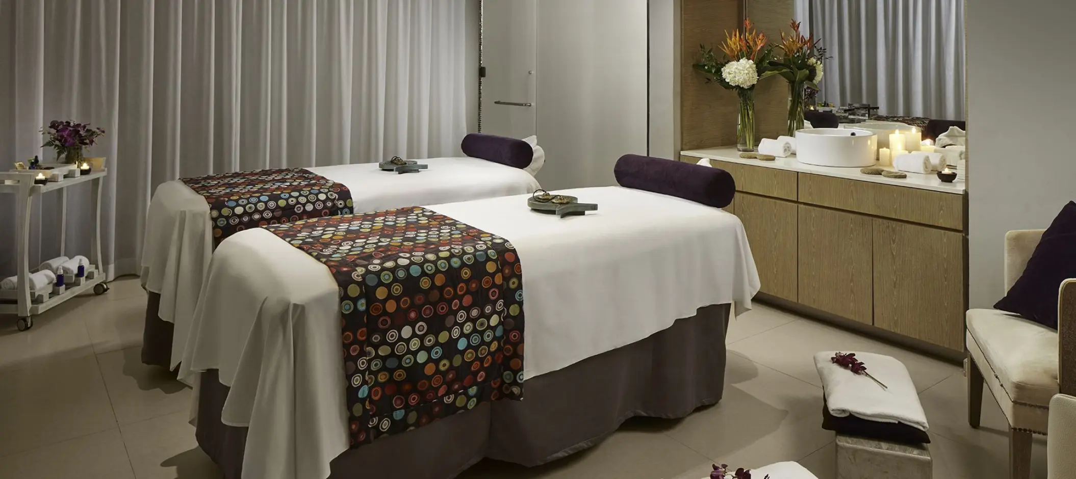 Couples spa treatment room with two massage tables at Azul Beach Resort Negril, Jamaica