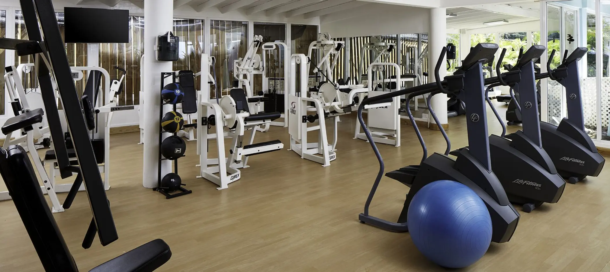 Fitness center with weight machines and elliptical trainers at Azul Beach Resort Negril