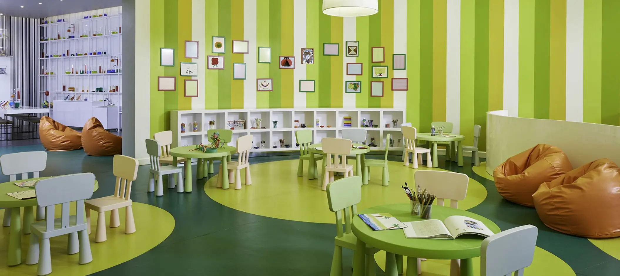 Colorful kids club with small tables and beanbags at Azul Beach Resort Negril