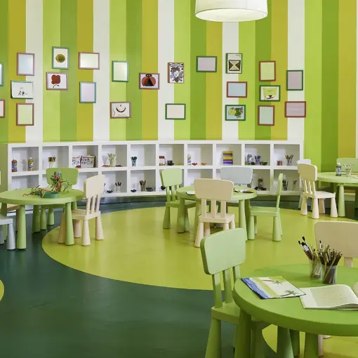 Colorful kids club with small tables and beanbags at Azul Beach Resort Negril