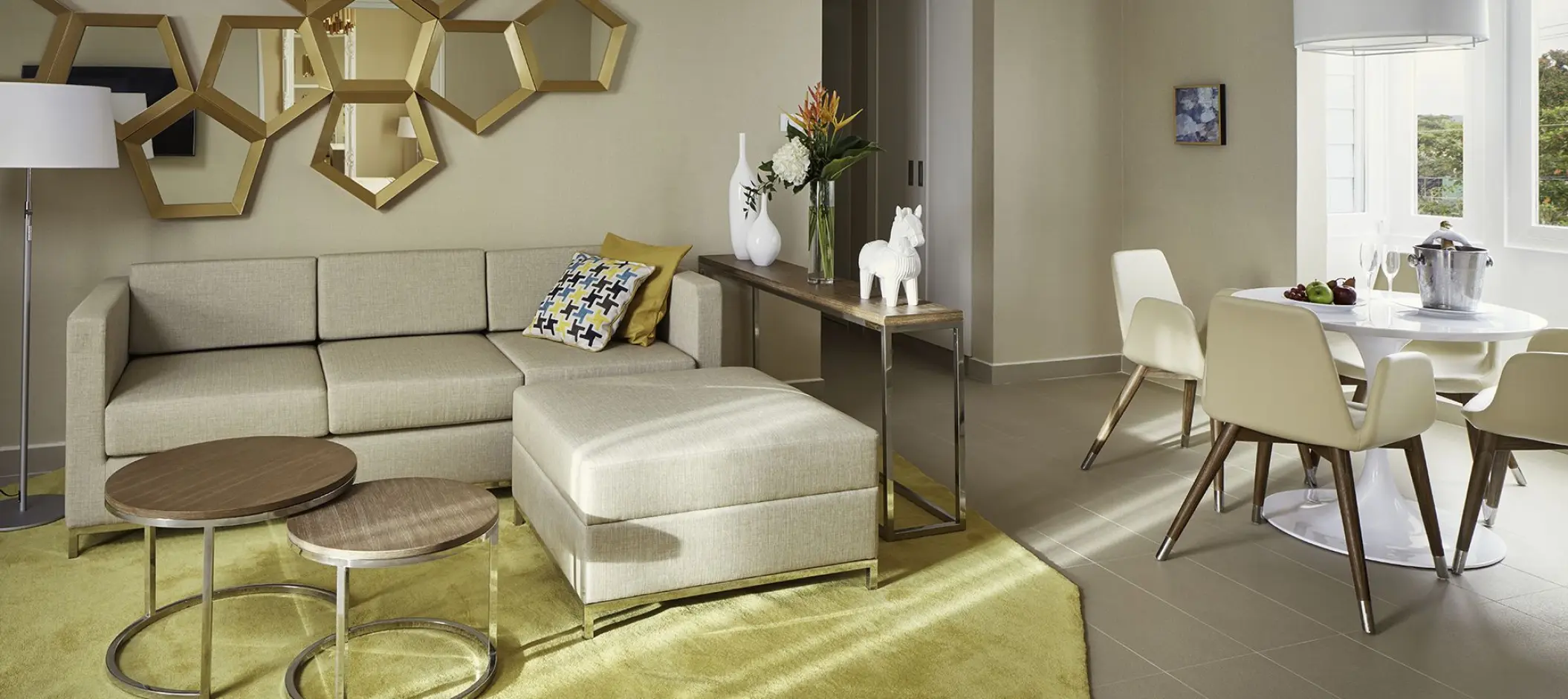 Modern living room area and dining suite at Azul Beach Resort Negril, Negril