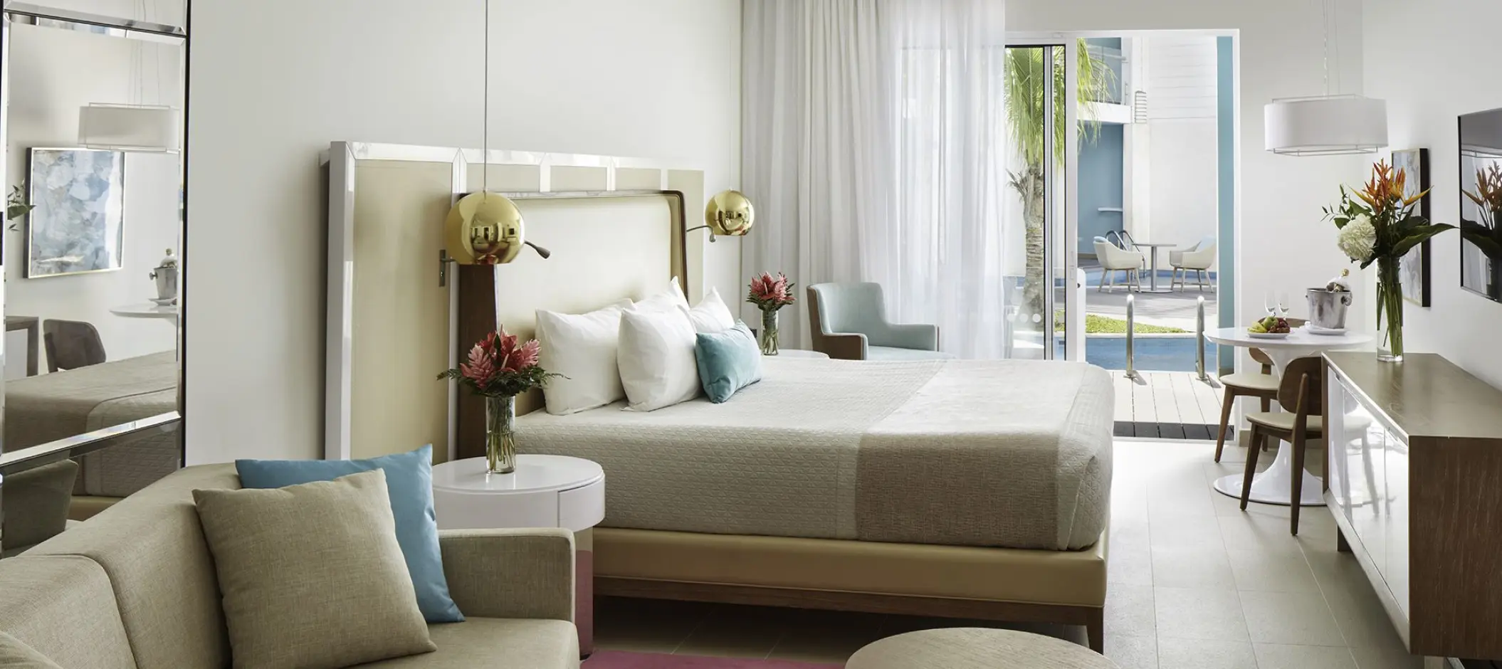 Modern swim-up suite interior with neutral tones and gold accents at Azul Beach Resort Negril