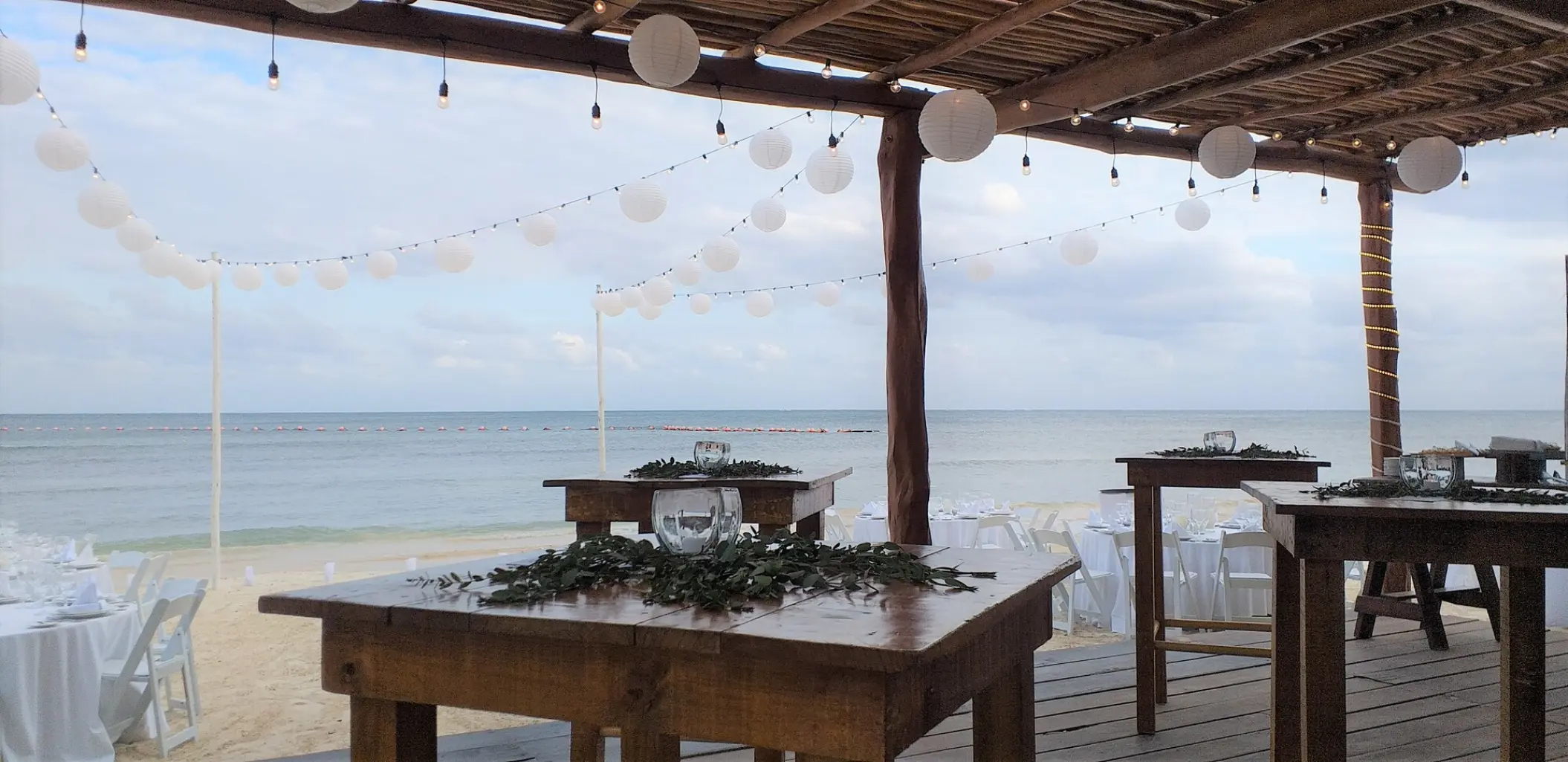 Palapa wedding reception with paper lanterns at Azul Beach Negril