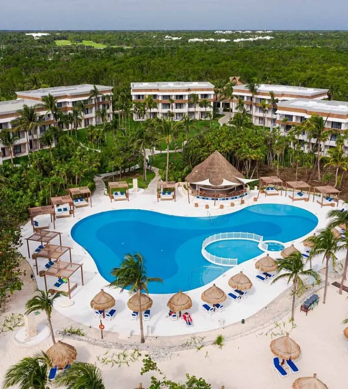 Aerial view of the swimming pool and guest buildings at Bahia Principe Grand, Tulum