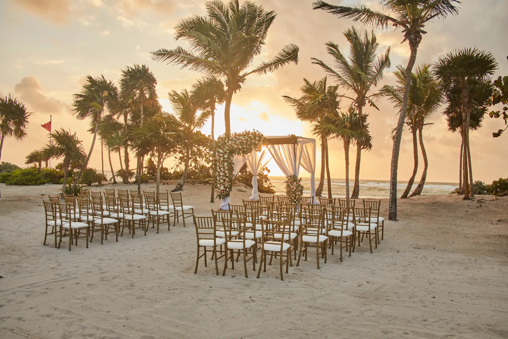 Beachfront wedding ceremony setup at Bahia Principe Grand Tulum, Tulum