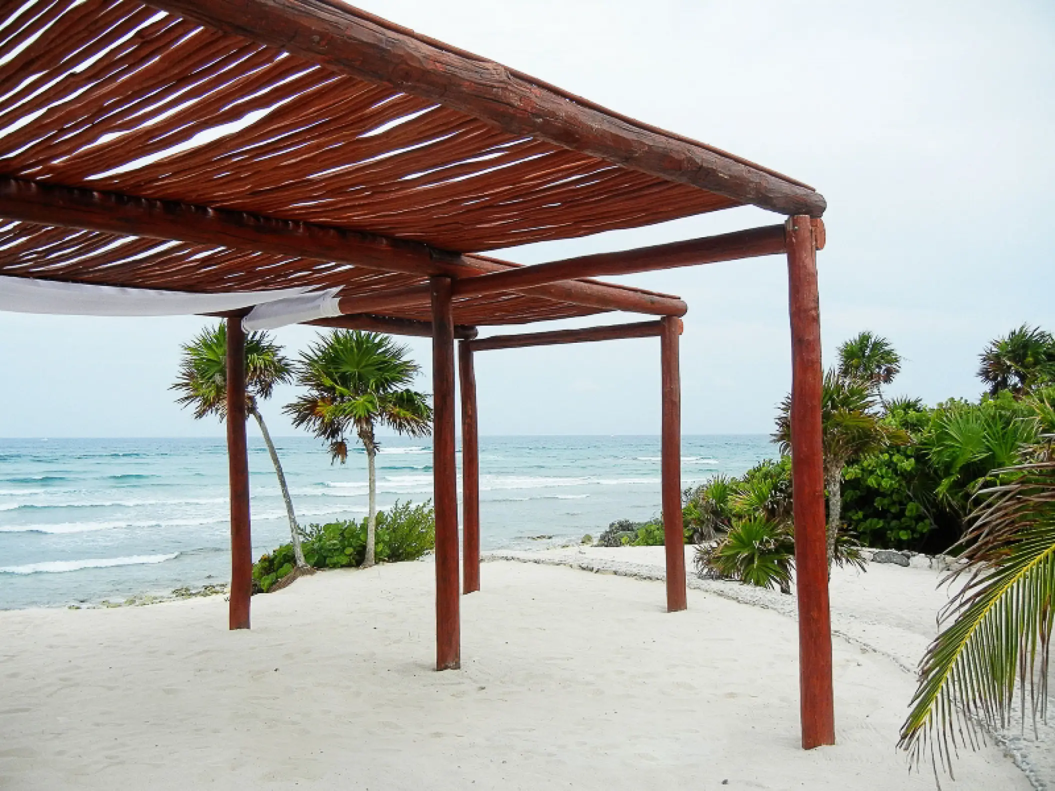 Wooden beach wedding pergola at Bahia Principe Grand Tulum, Tulum