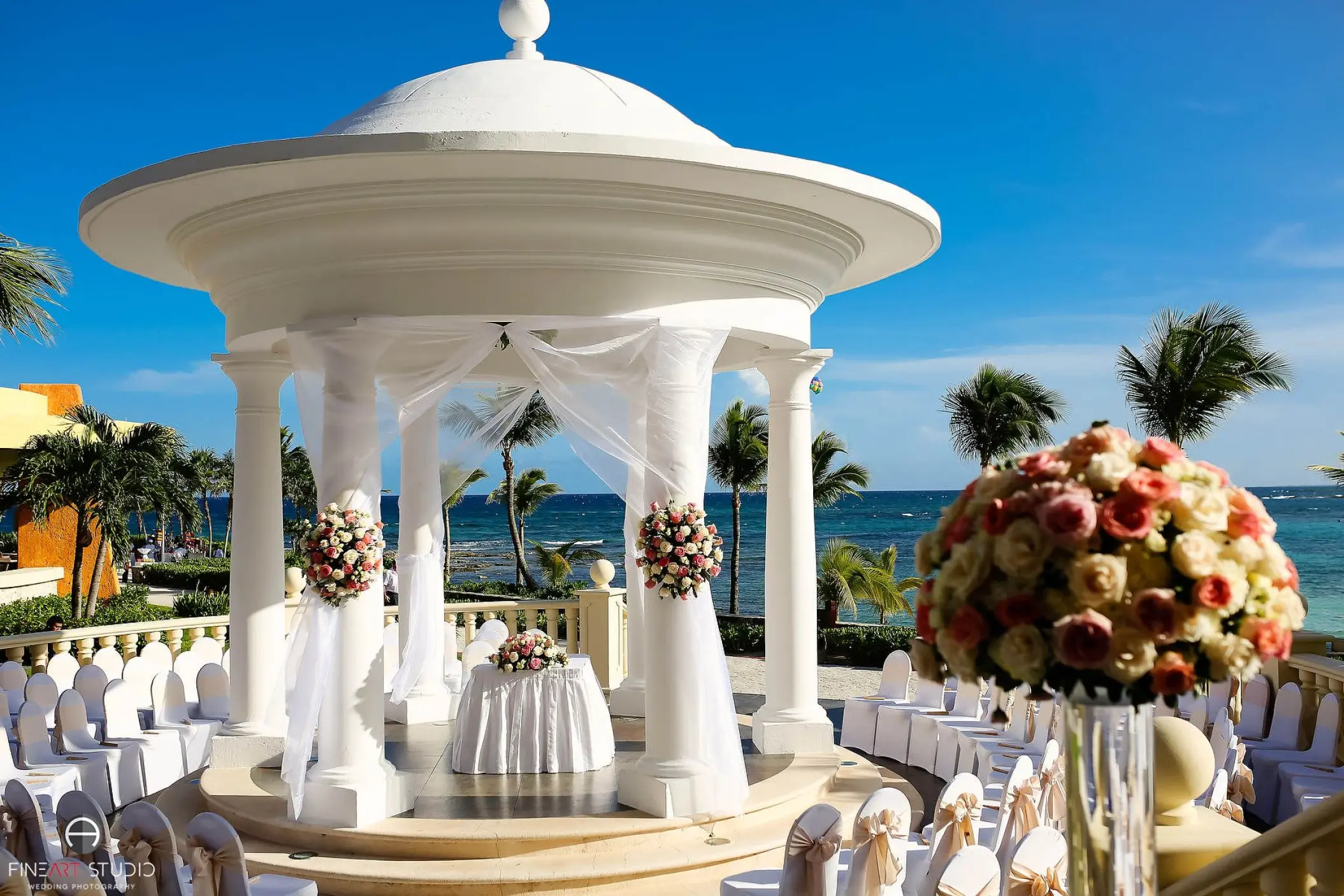 Oceanfront wedding ceremony at the white gazebo in Barcelo Maya Riviera, Riviera Maya