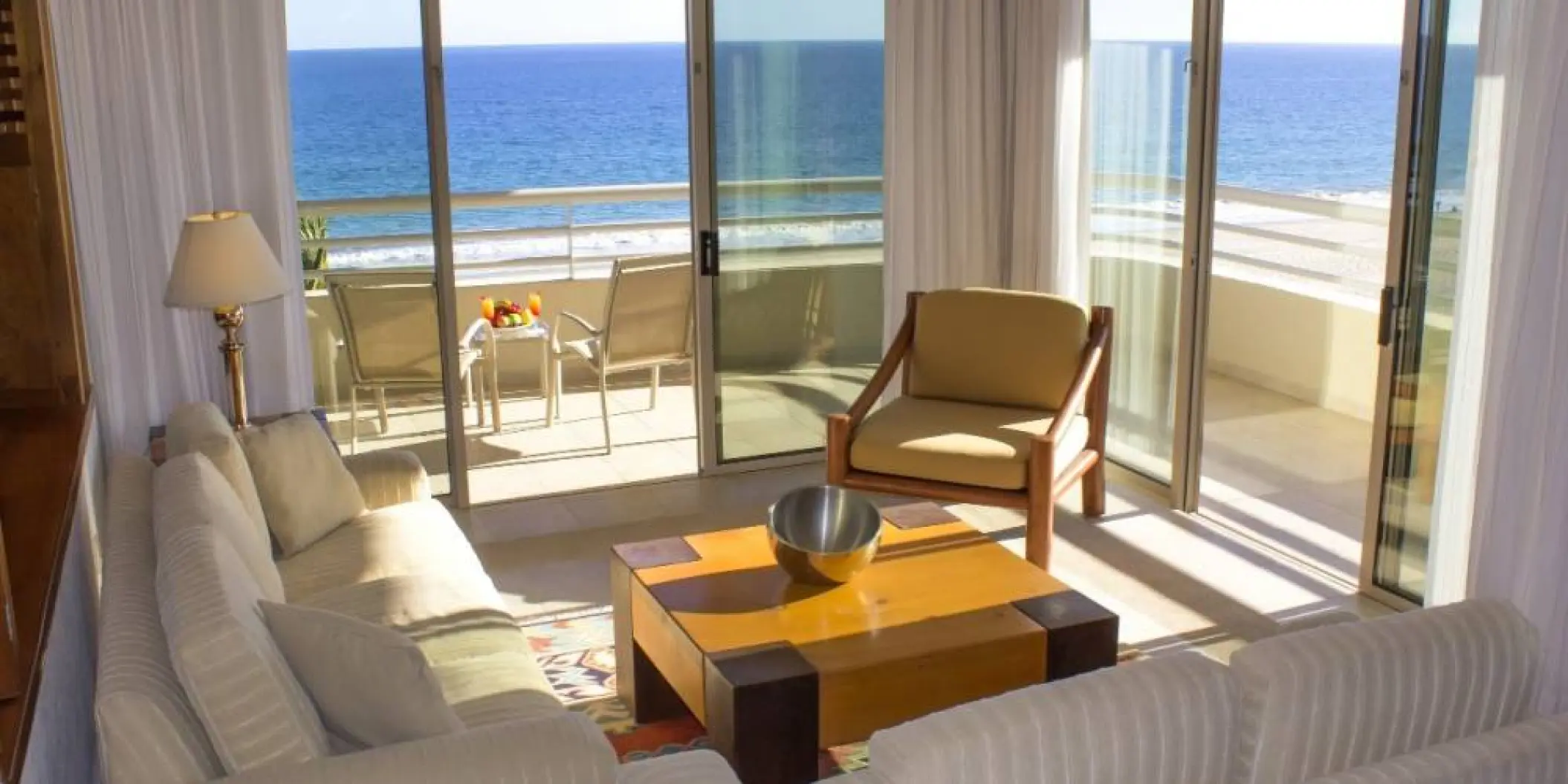 Barcelo Gran Faro Los Cabos suite living area with ocean view balcony, Cabo San Lucas