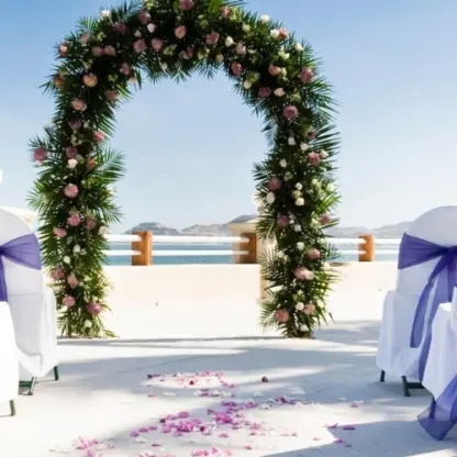 Floral arch at a terrace wedding ceremony at Barcelo Gran Faro Los Cabos, Cabo San Lucas