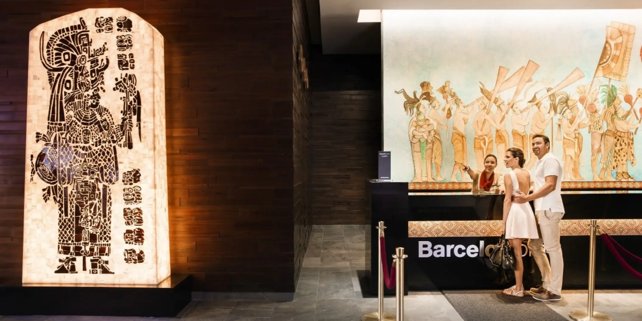 Lobby reception desk with Mayan-style art at Barcelo Maya Caribe, Riviera Maya