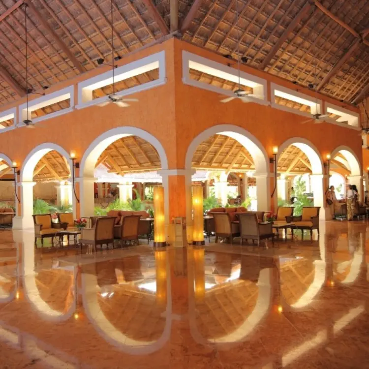 Barcelo Maya Colonial open-air lobby with vaulted ceilings and polished floors, Riviera Maya