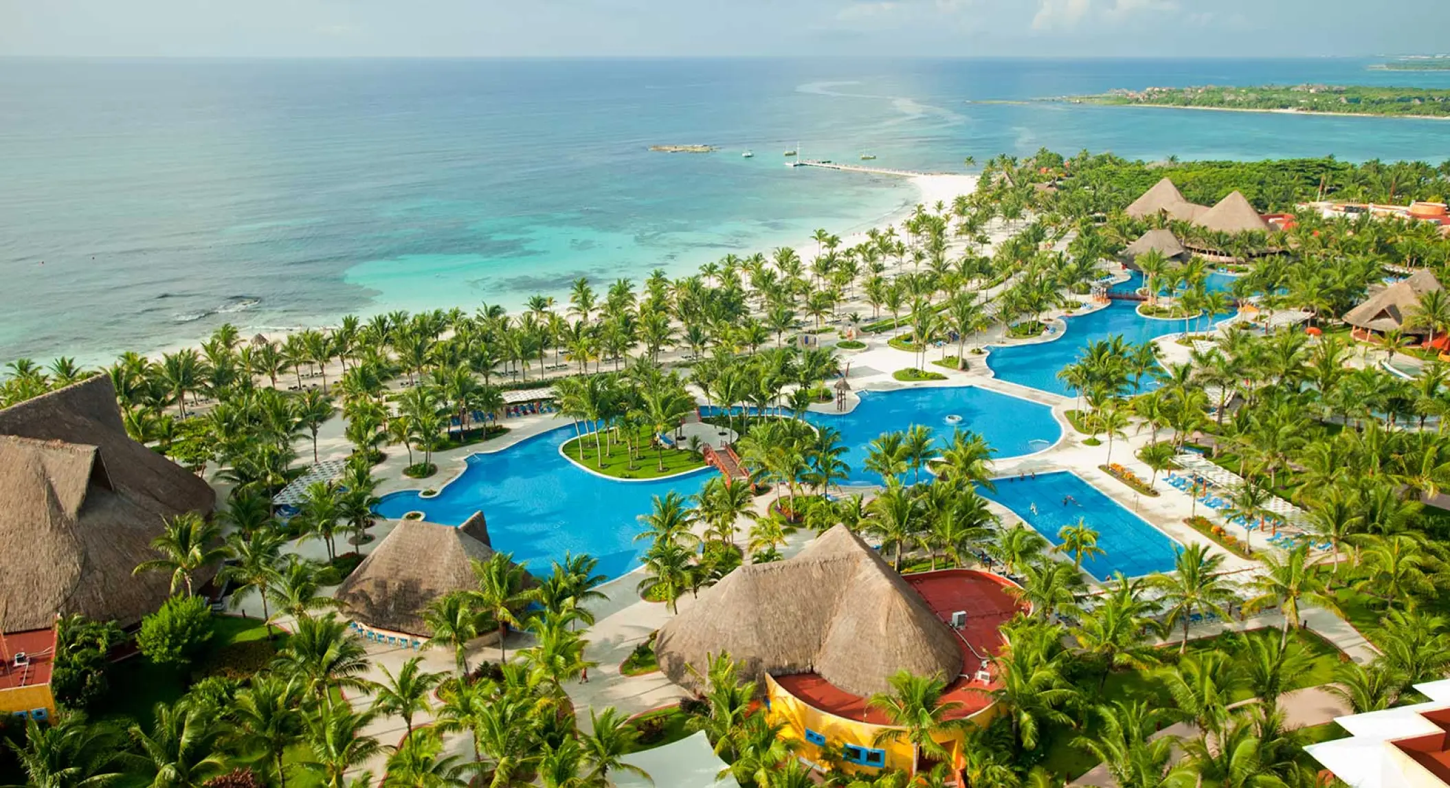 Aerial view of the pools and beachfront at Barcelo Maya Palace, Riviera Maya
