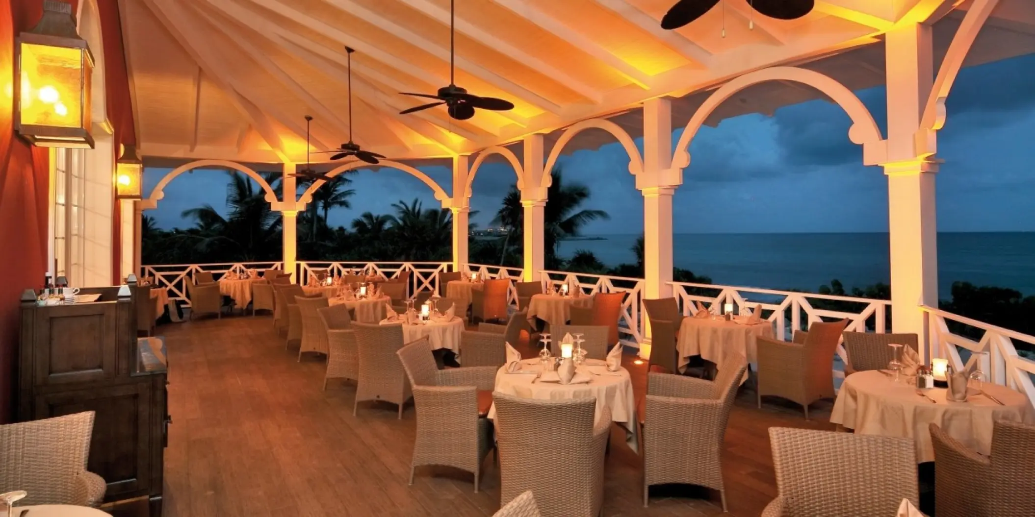 Covered terrace restaurant with white arches at Barcelo Maya Palace, Riviera Maya