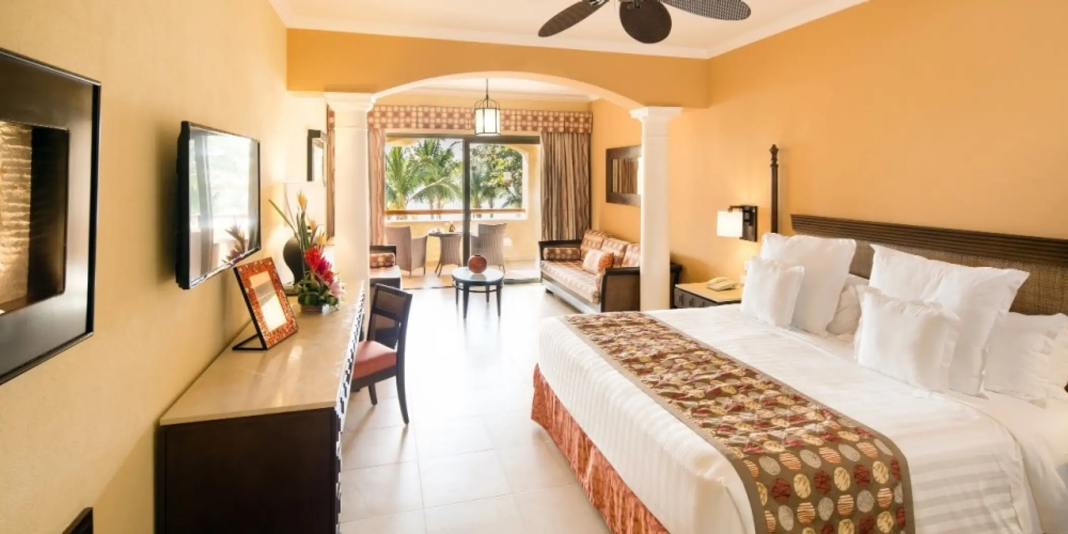 Barcelo Maya Palace suite with king bed and private balcony, Riviera Maya