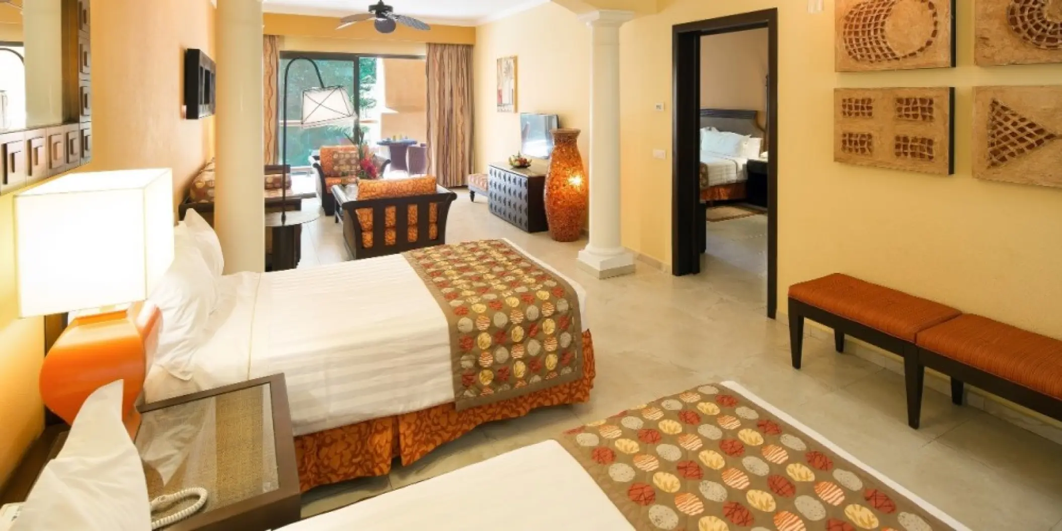 Barcelo Maya Palace suite with two beds and lounge area, Riviera Maya