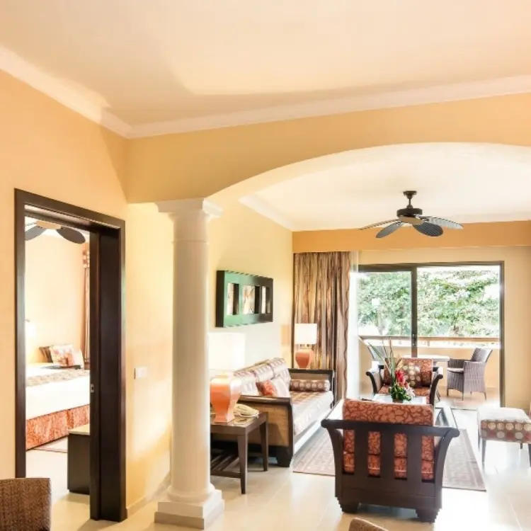 Barcelo Maya Palace suite living area with balcony, Riviera Maya