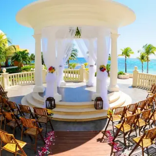 Oceanfront wedding gazebo with rows of chairs at Barcelo Maya Palace, Riviera Maya