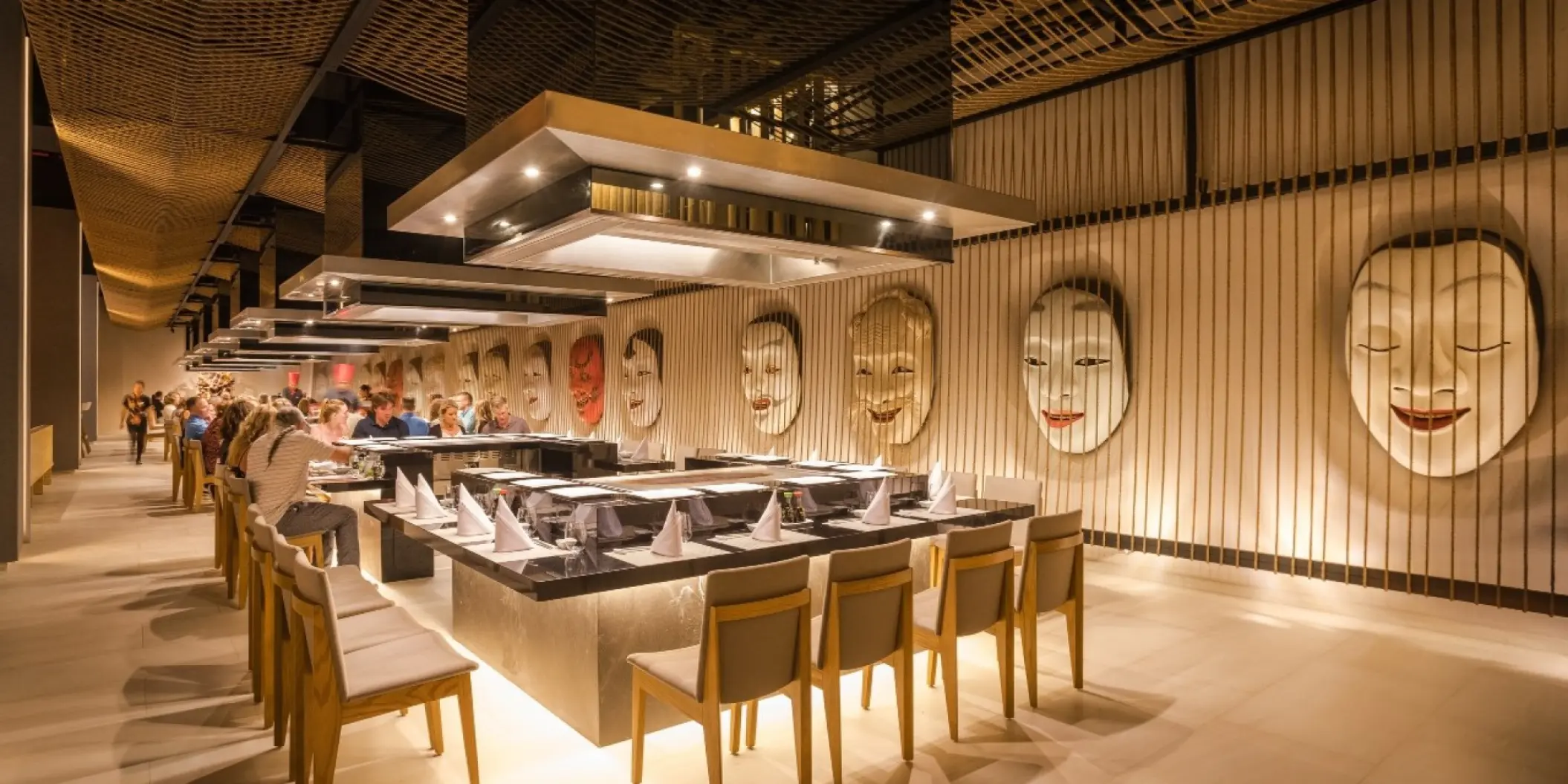 Asian restaurant with teppanyaki grills and traditional mask decor at Barcelo Maya Riviera, Riviera Maya