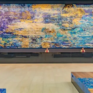 Barcelo Maya Riviera lobby reception desk with a large colorful mural, Riviera Maya