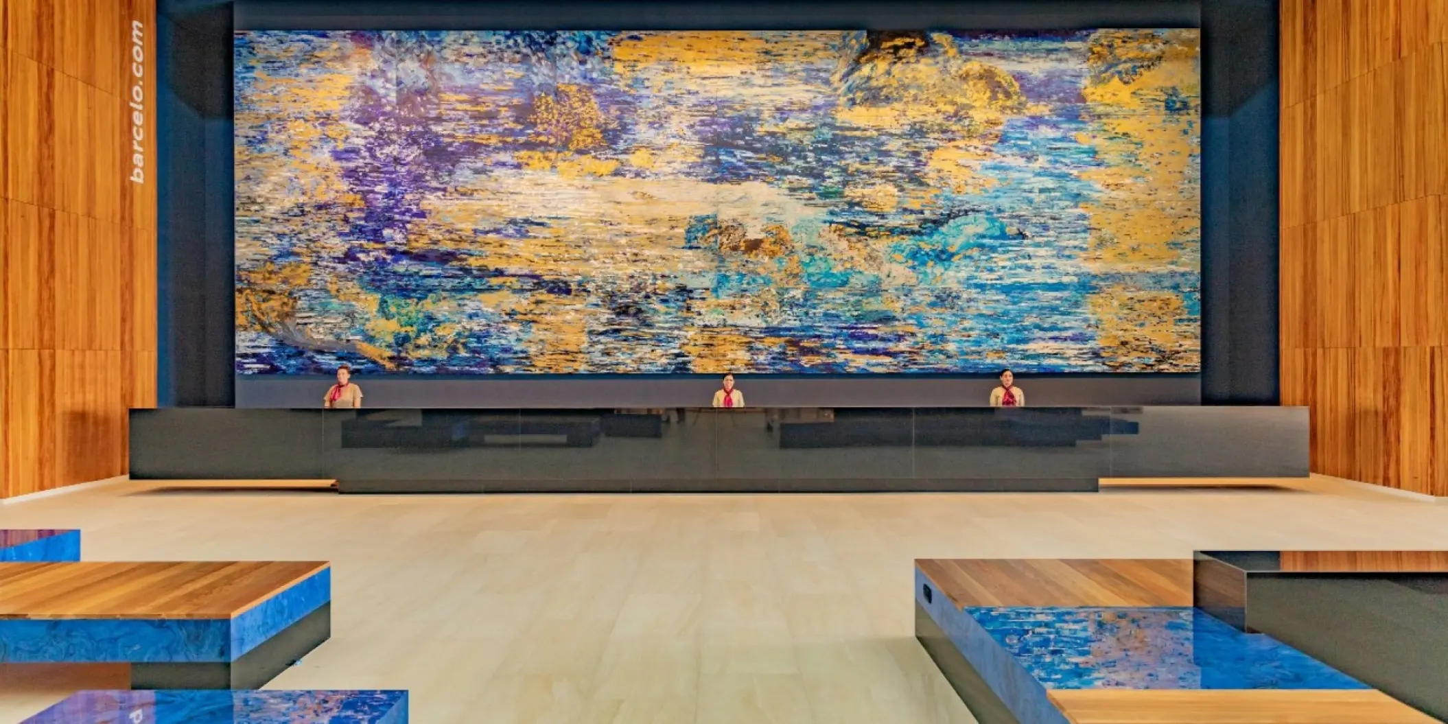 Barcelo Maya Riviera lobby reception desk with a large colorful mural, Riviera Maya