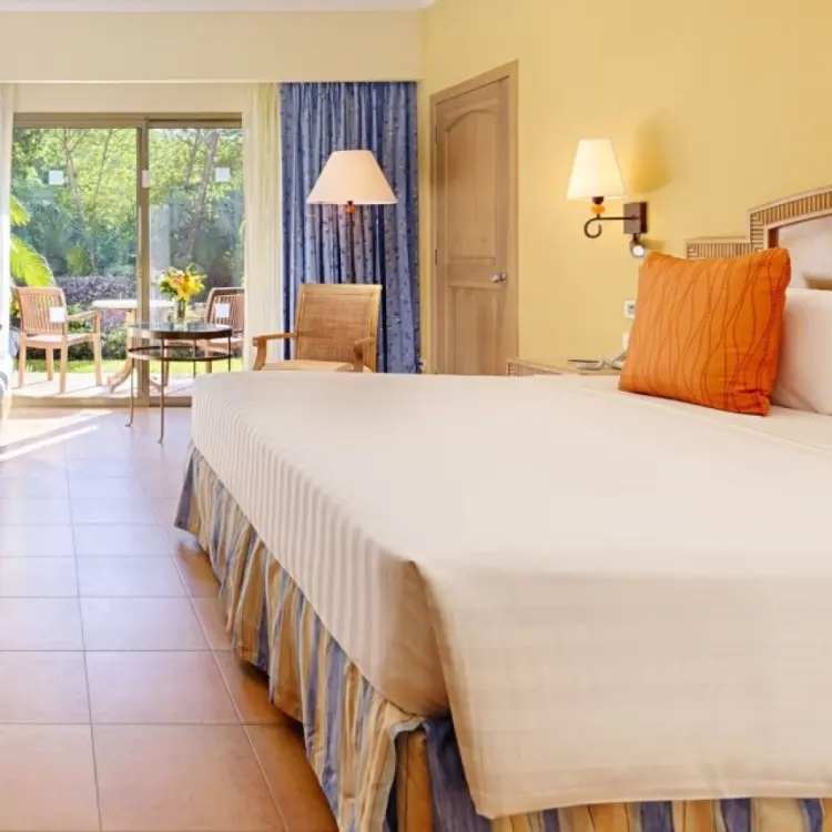 Barcelo Maya Tropical guest room with king bed and balcony, Riviera Maya