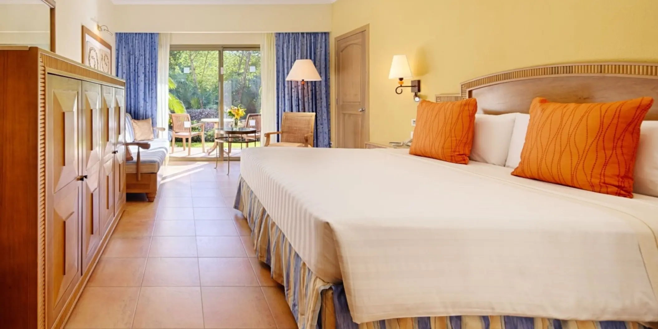 Barcelo Maya Tropical guest room with king bed and balcony, Riviera Maya