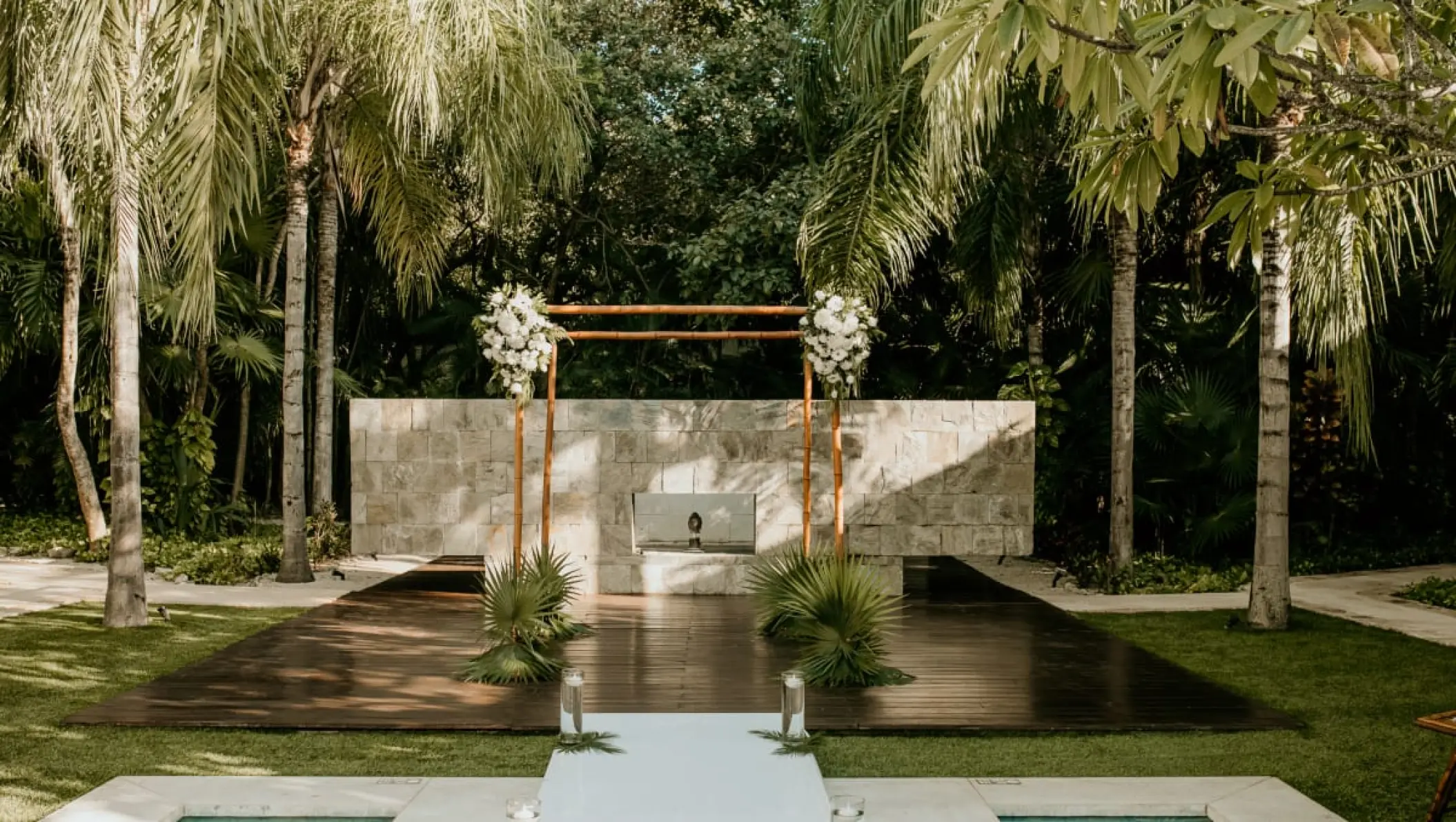 Wooden wedding ceremony arch on a garden terrace at Blue Diamond Luxury Boutique, Playa Del Carmen