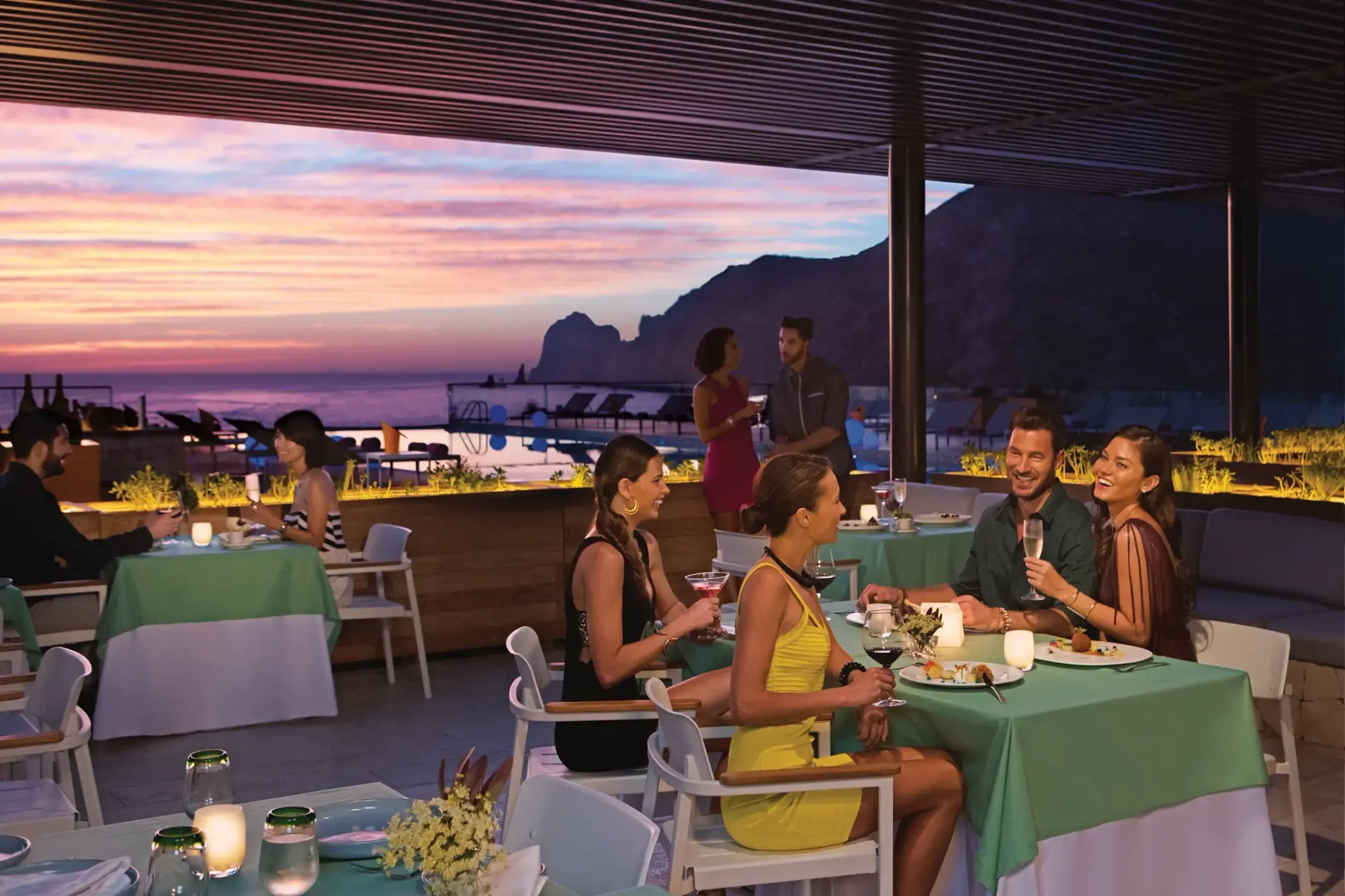 Kibbeh restaurant outdoor dining at Breathless Cabo San Lucas overlooking the ocean at sunset