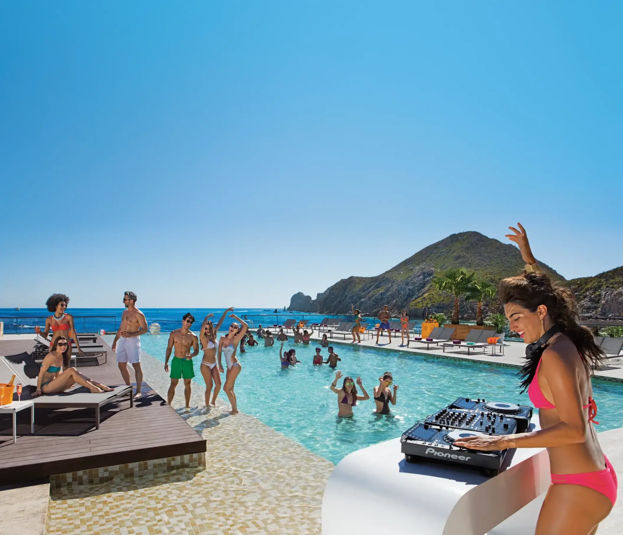 DJ performing at the main infinity pool at Breathless Cabo San Lucas