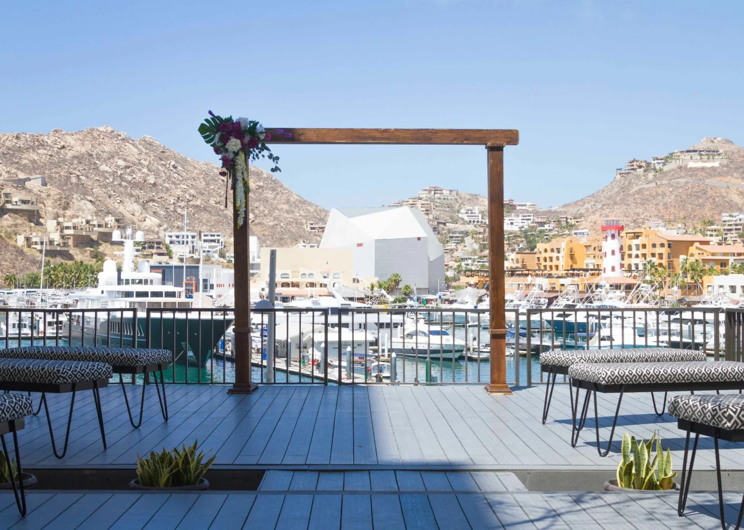 Ceremony decor on purple rooftop lounge at Breathless Cabo San Lucas Resort and Spa