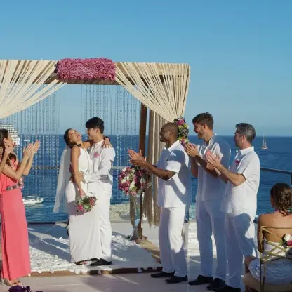 Rooftop wedding ceremony overlooking a cruise ship at Breathless Cabo San Lucas