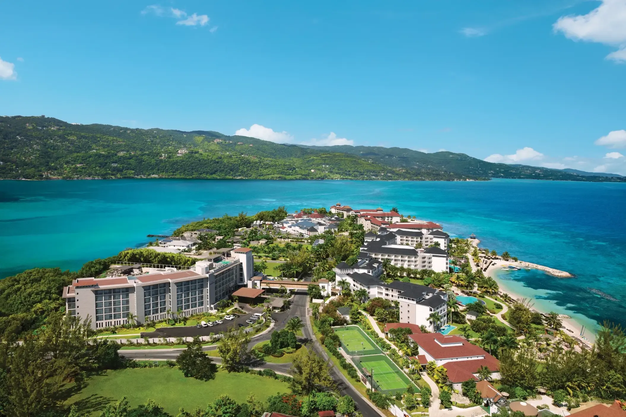 Aerial view of Breathless Montego Bay buildings and grounds on a peninsula, Montego Bay