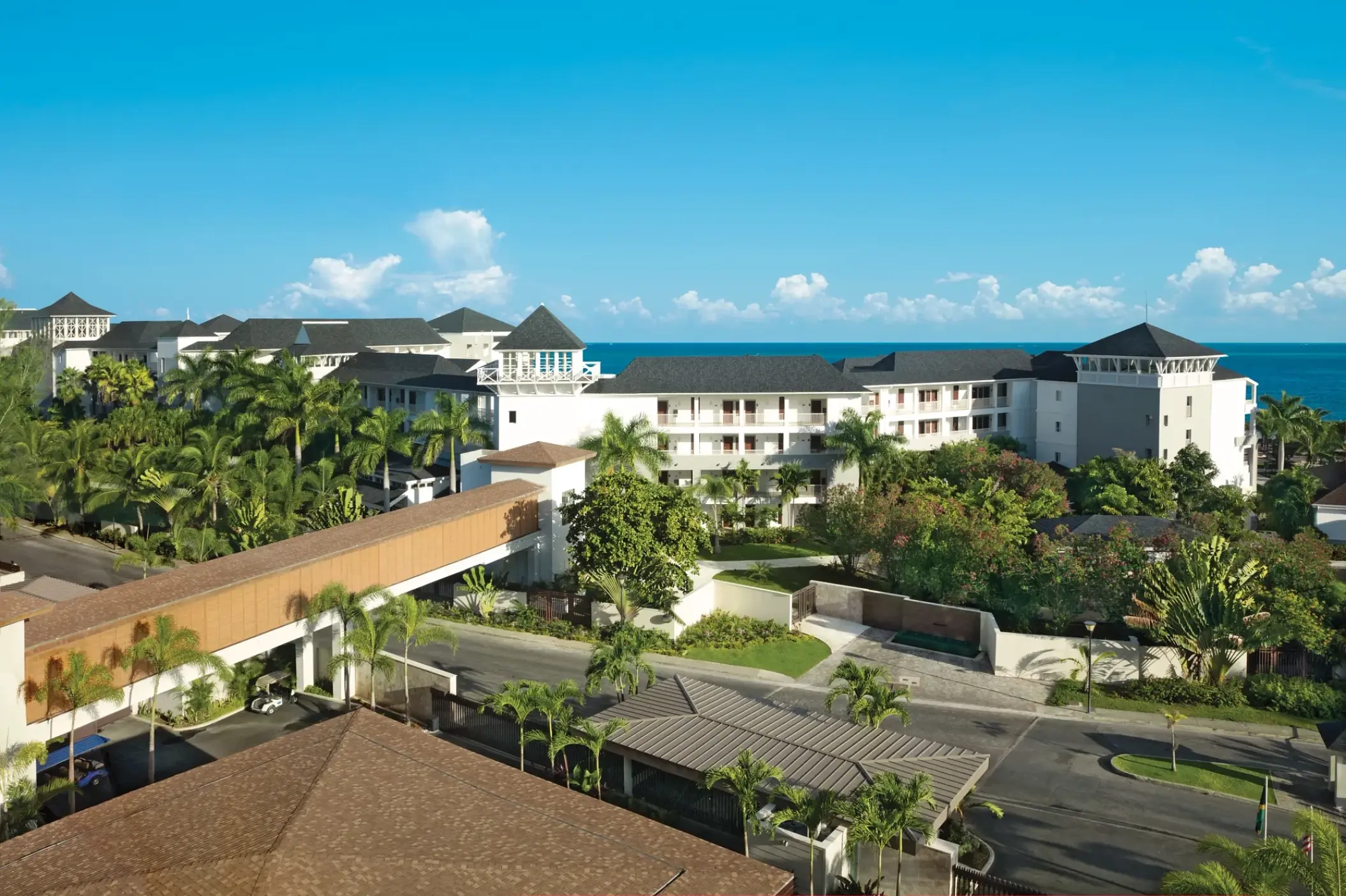Aerial view of the pedestrian bridge and resort grounds at Breathless Montego Bay, Montego Bay